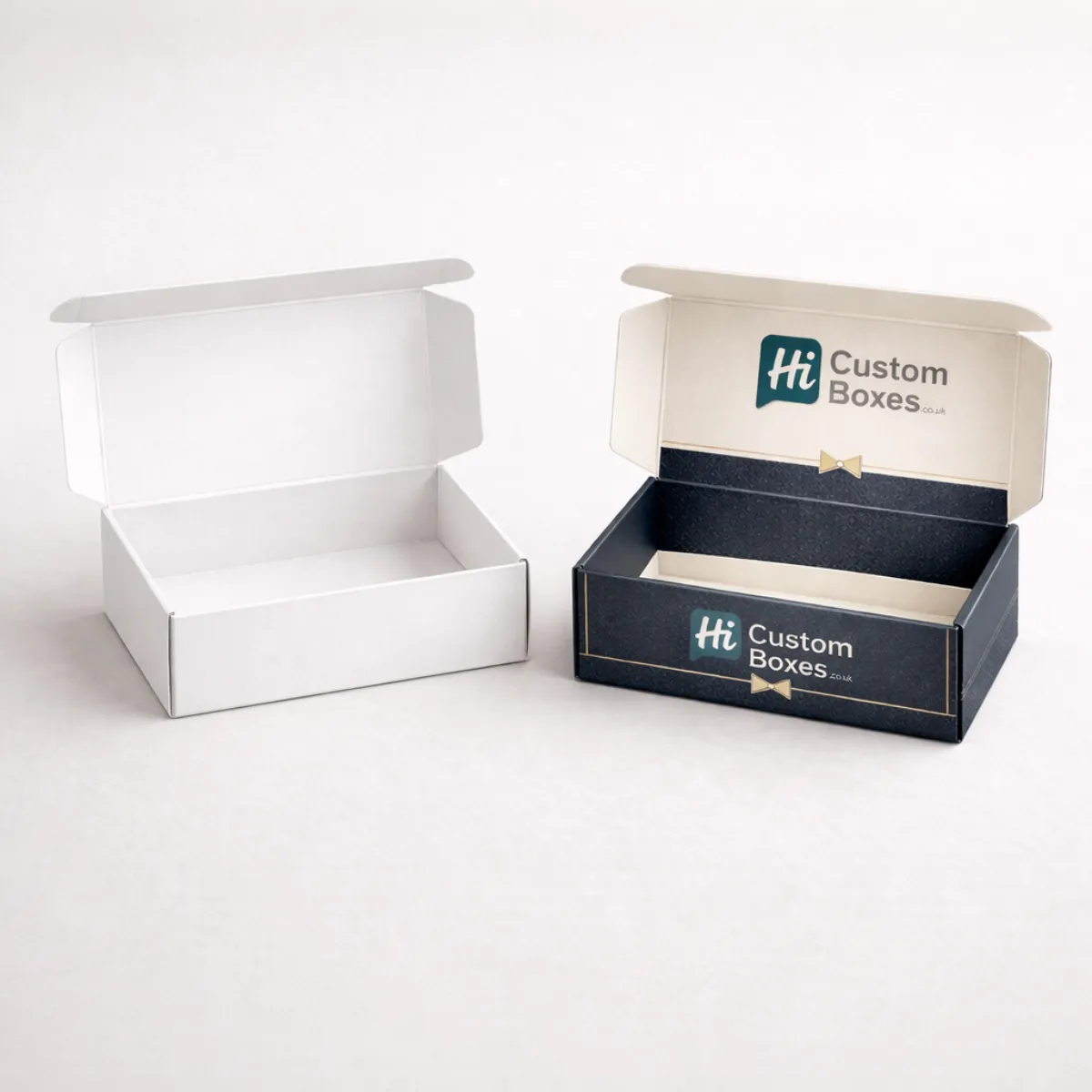 Two open cardboard mailer boxes showcasing a plain white interior and a branded navy design- class=